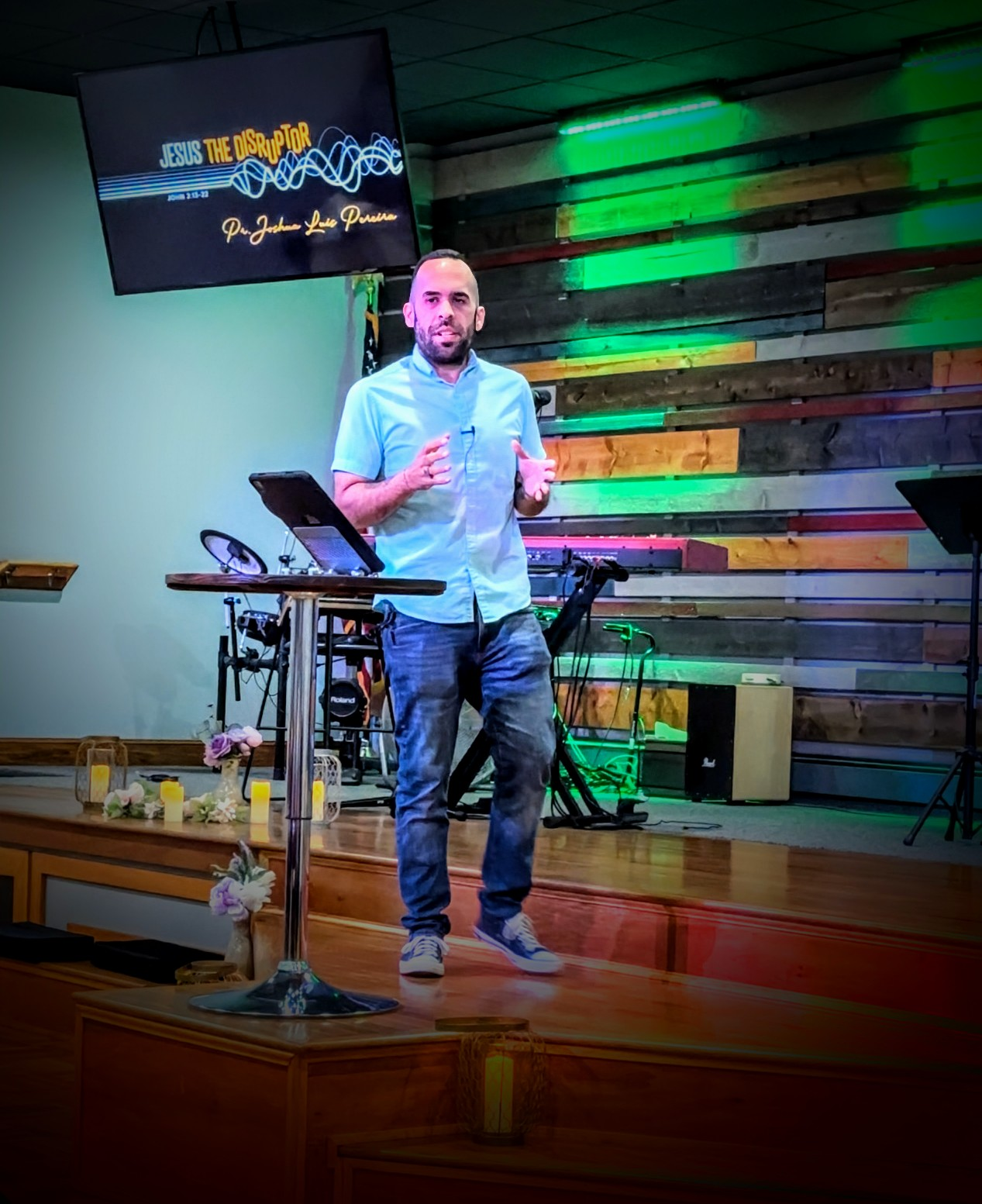 Joshua Luis Pereira preaching on stage